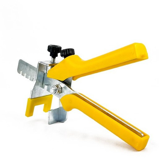 Pliers equal to yellow metal and ceramic tiles Professional tool for quick and uniform installation of tiles